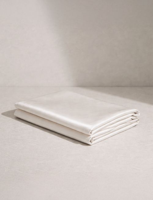 SilkyBare Mulberry Silk Pillowcase in ivory — premium silk bedding for skin and hair care
