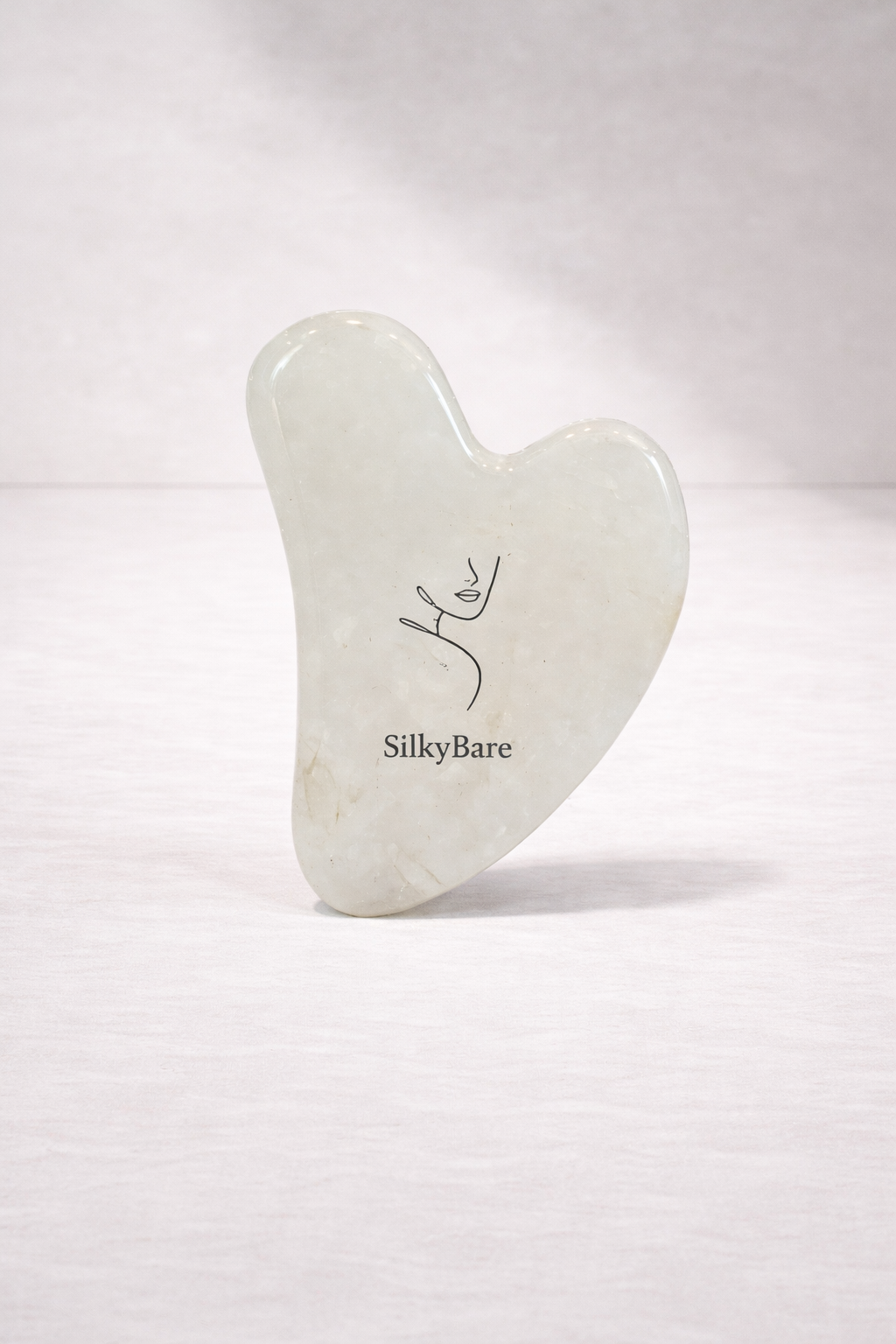 SilkyBare gua sha tool on a white background